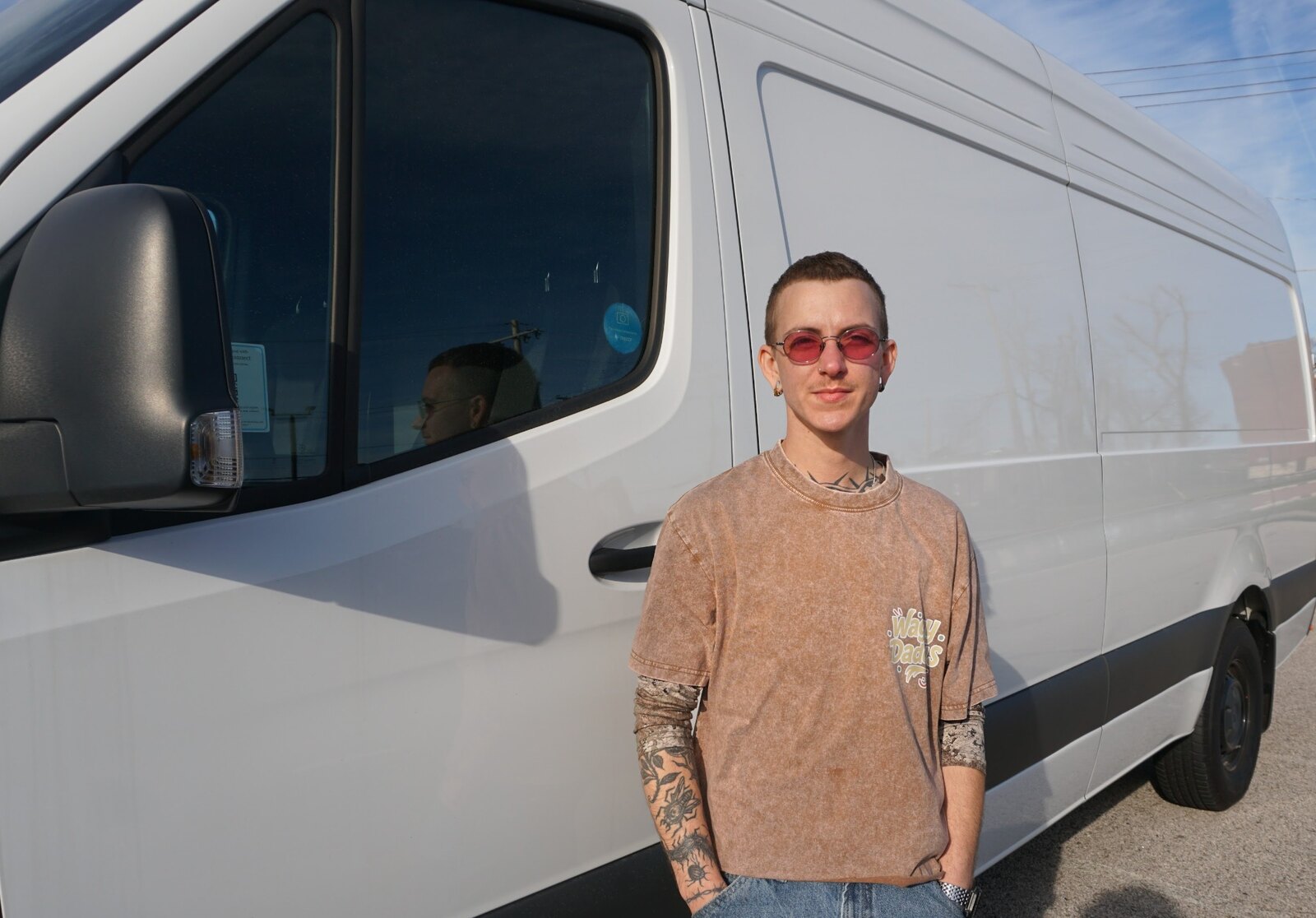 Murphy standing beside the Waggy Daddys grooming van
